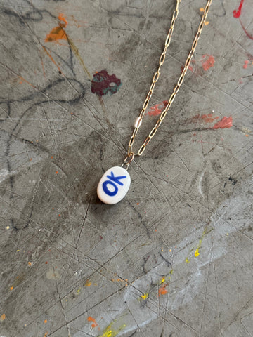 White Porcelain OK Bye Pendant Necklace in 18" Gold Paperclip Chain